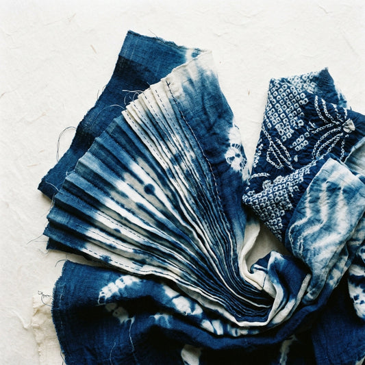 AI-generated editorial shibori textile thumbnail for Journal article